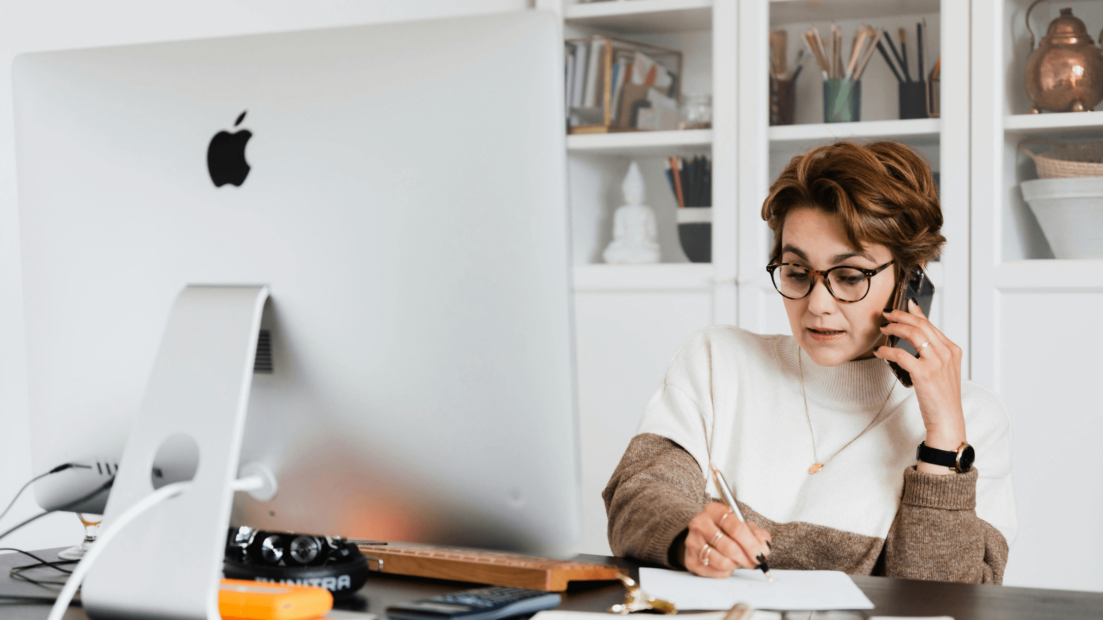 Woman deep in thought actively listening to colleague on the phone 