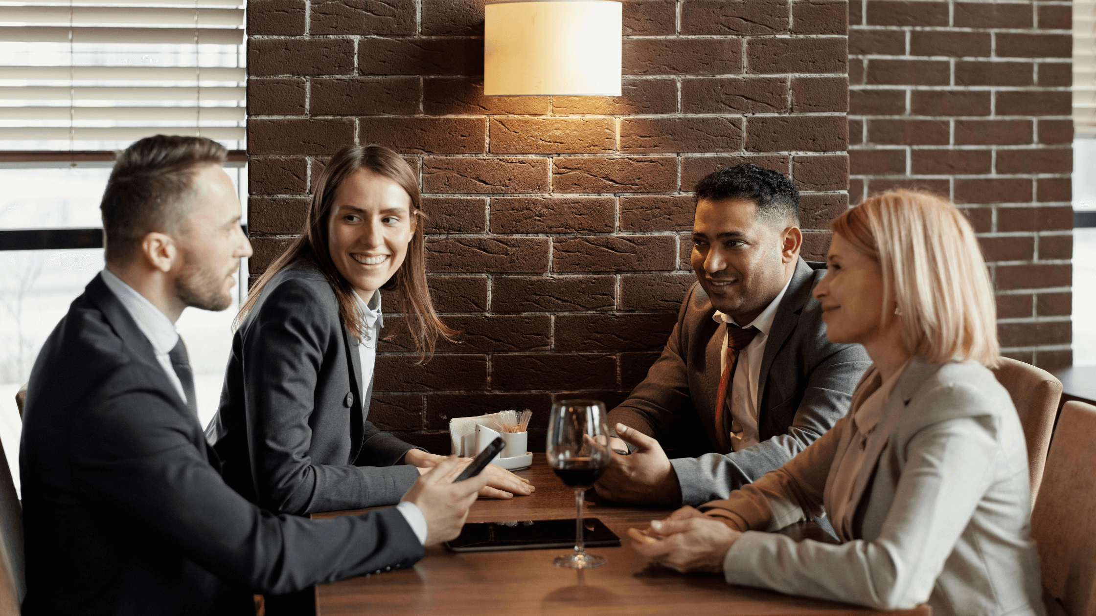 Coworkers talking over a meal 
